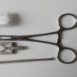 A set of surgical tools including scissors on a clean white background.